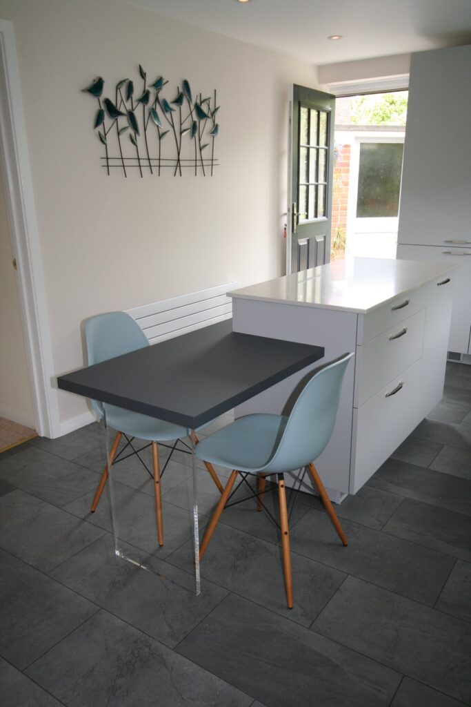 Concrete Grey, and an island that does both jobs — a Rational kitchen by Kitchensmiths (photograph 3 of 4)