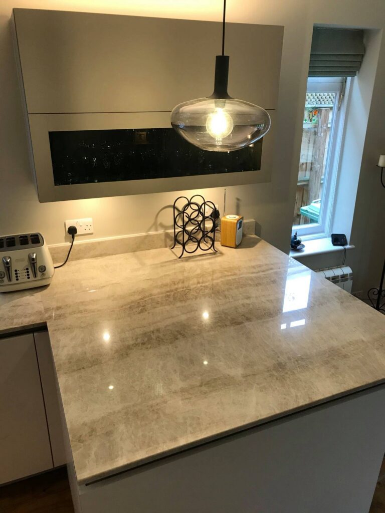 Fenix fronts and Taj Mahal stone — a BAX kitchen by Kitchensmiths, with sensa Taj Mahal worktops (photograph 2 of 7)
