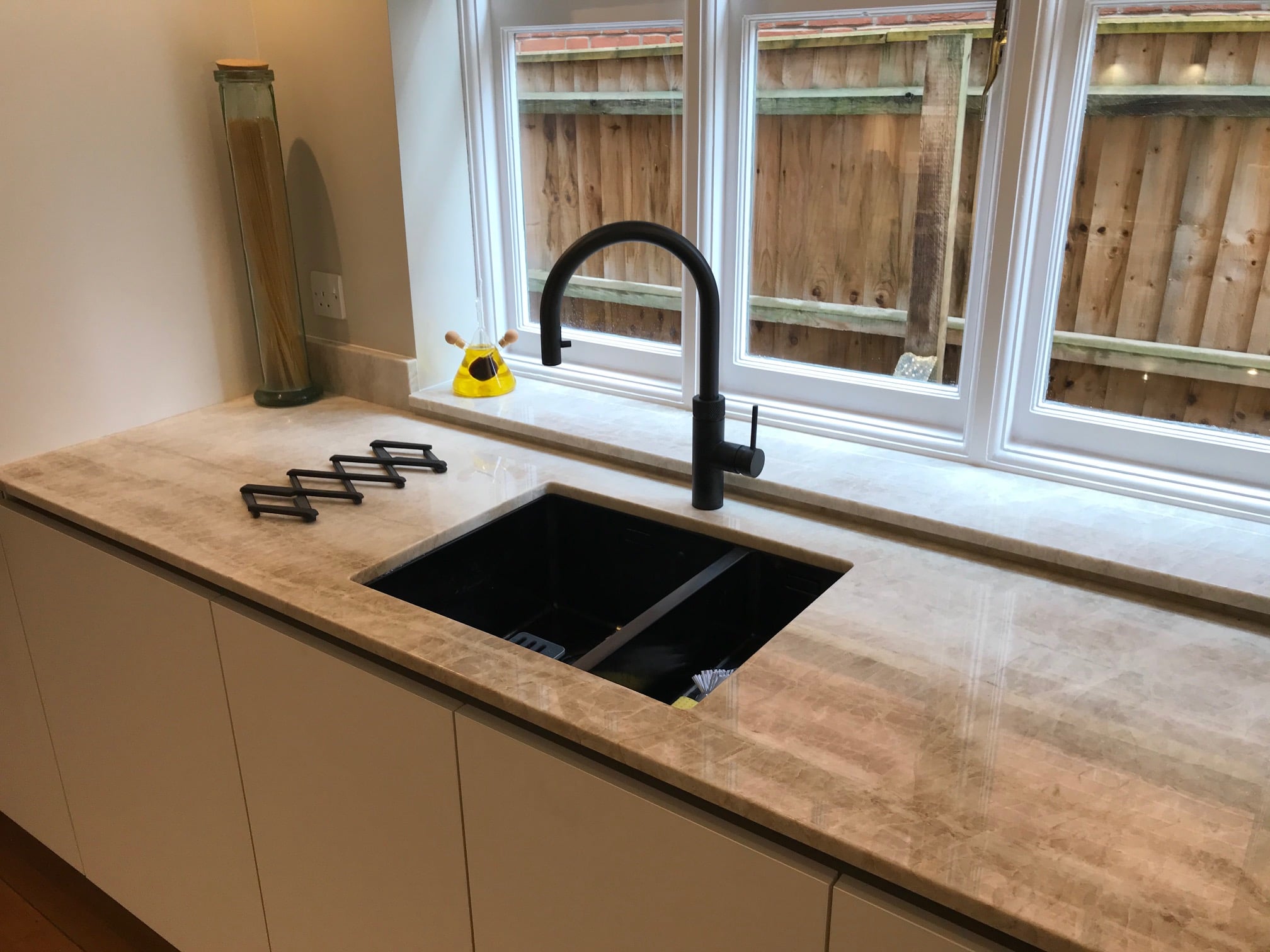 Fenix fronts and Taj Mahal stone — a BAX kitchen by Kitchensmiths, with sensa Taj Mahal worktops (photograph 5 of 7)