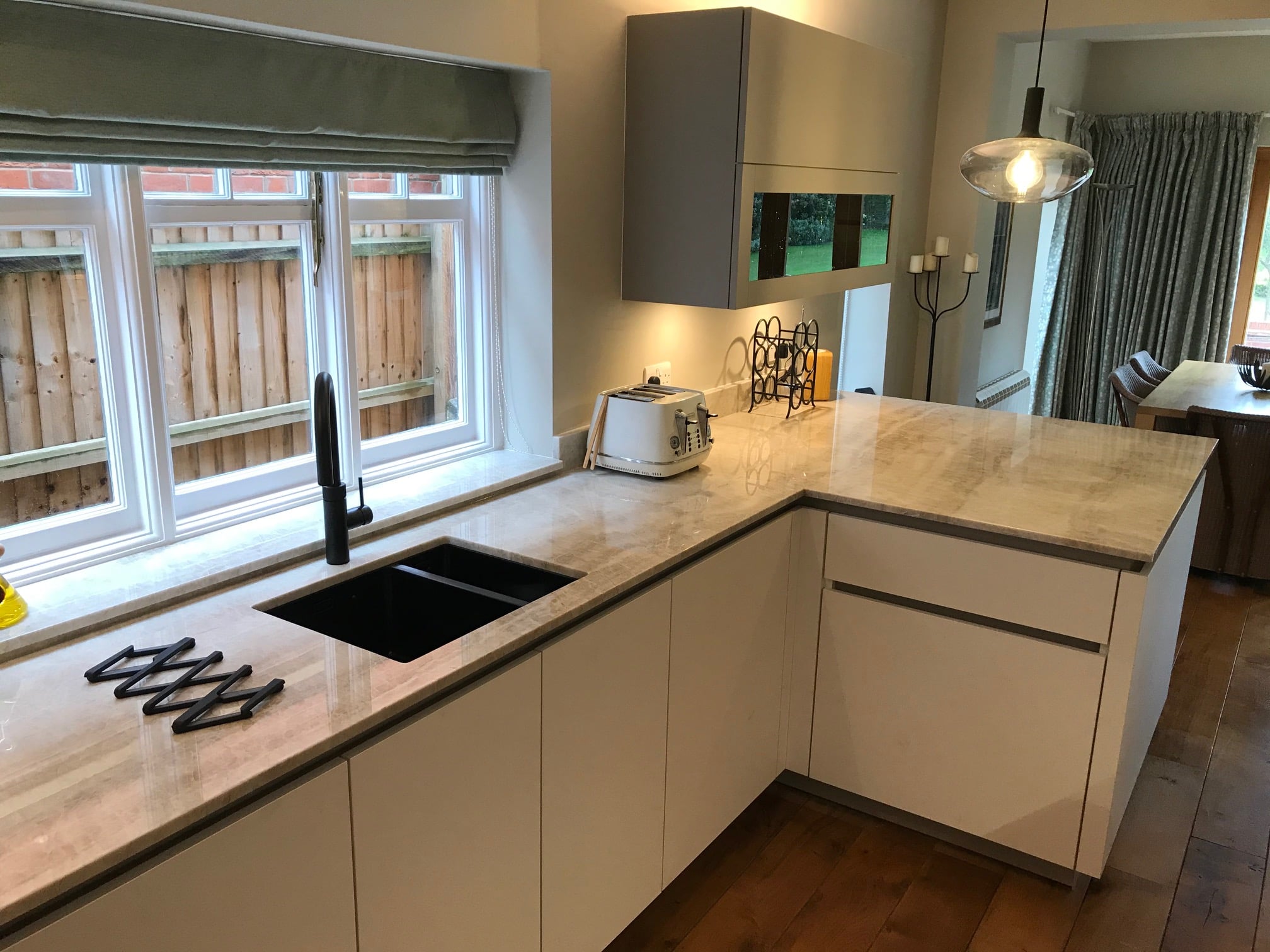 Fenix fronts and Taj Mahal stone — a BAX kitchen by Kitchensmiths, with sensa Taj Mahal worktops (photograph 6 of 7)