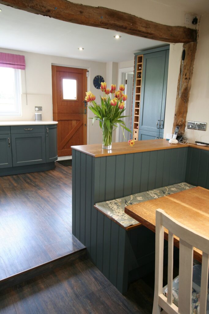 Thunder Grey in a cottage kitchen — a Stoneham kitchen by Kitchensmiths, with silestone Crema Marfil worktops (photograph 1 of 6)