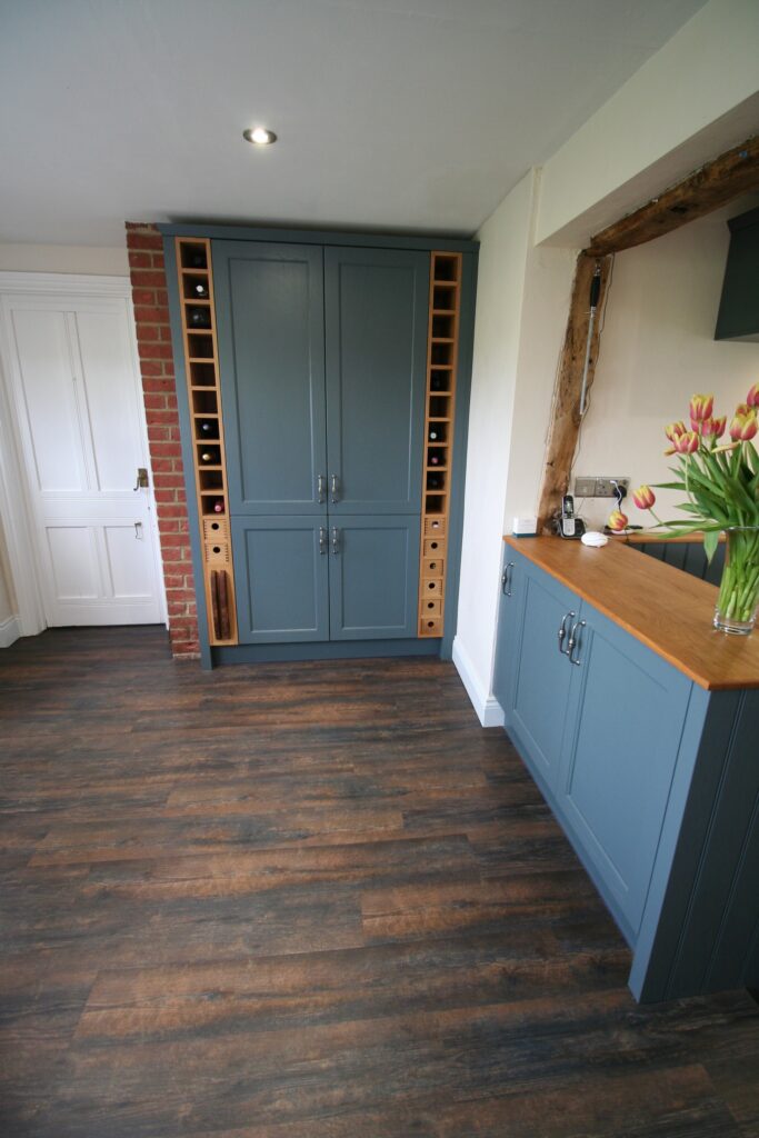 Thunder Grey in a cottage kitchen — a Stoneham kitchen by Kitchensmiths, with silestone Crema Marfil worktops (photograph 3 of 6)