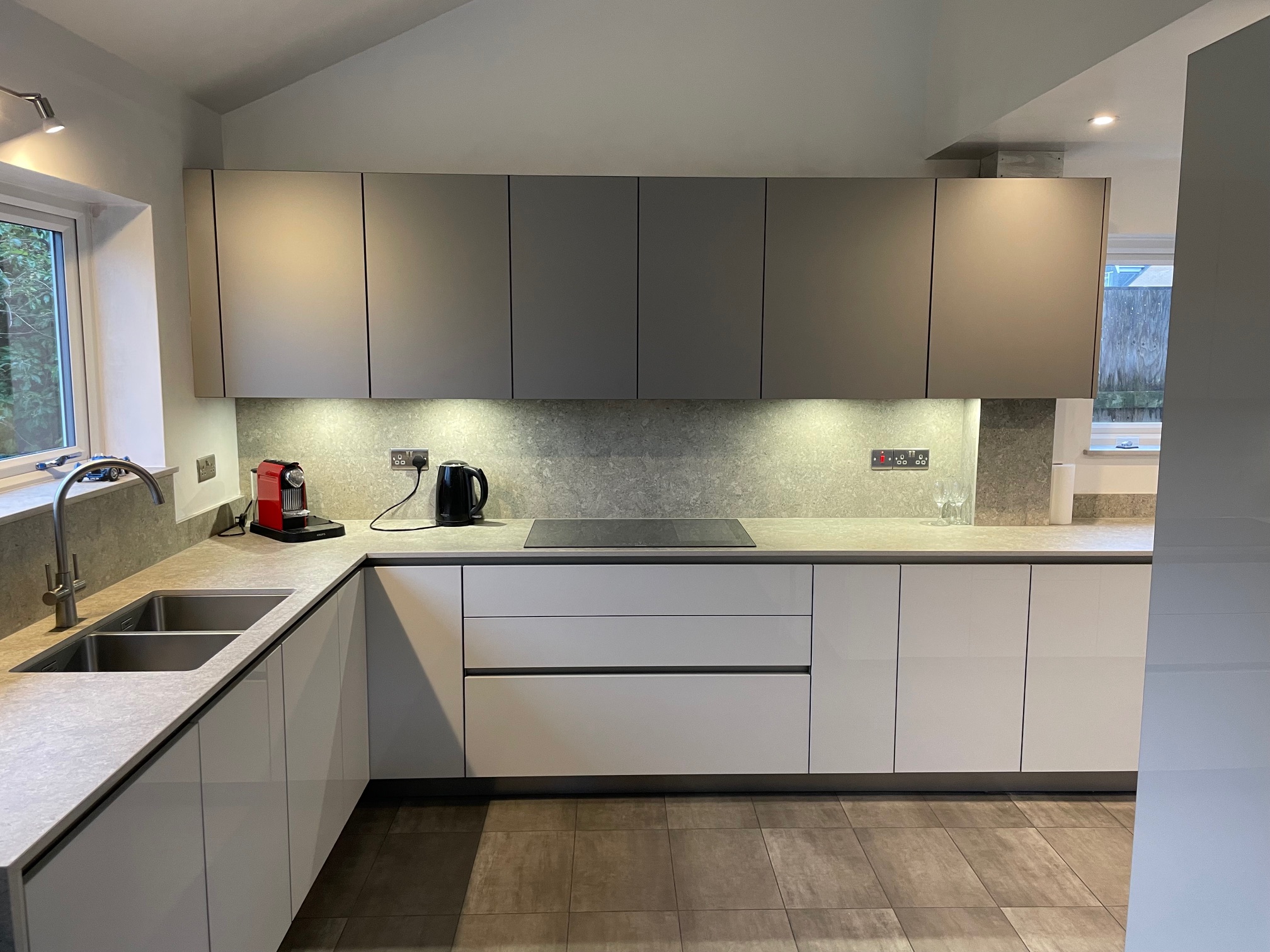 Matt and gloss, both — a Sachsenküchen kitchen by Kitchensmiths, with dekton Grigio worktops (photograph 1 of 6)
