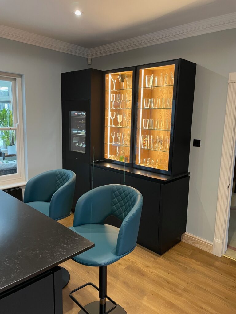 Fenix black and bookmatched oak — a Sachsenküchen kitchen by Kitchensmiths, with quartz worktops (photograph 4 of 5)