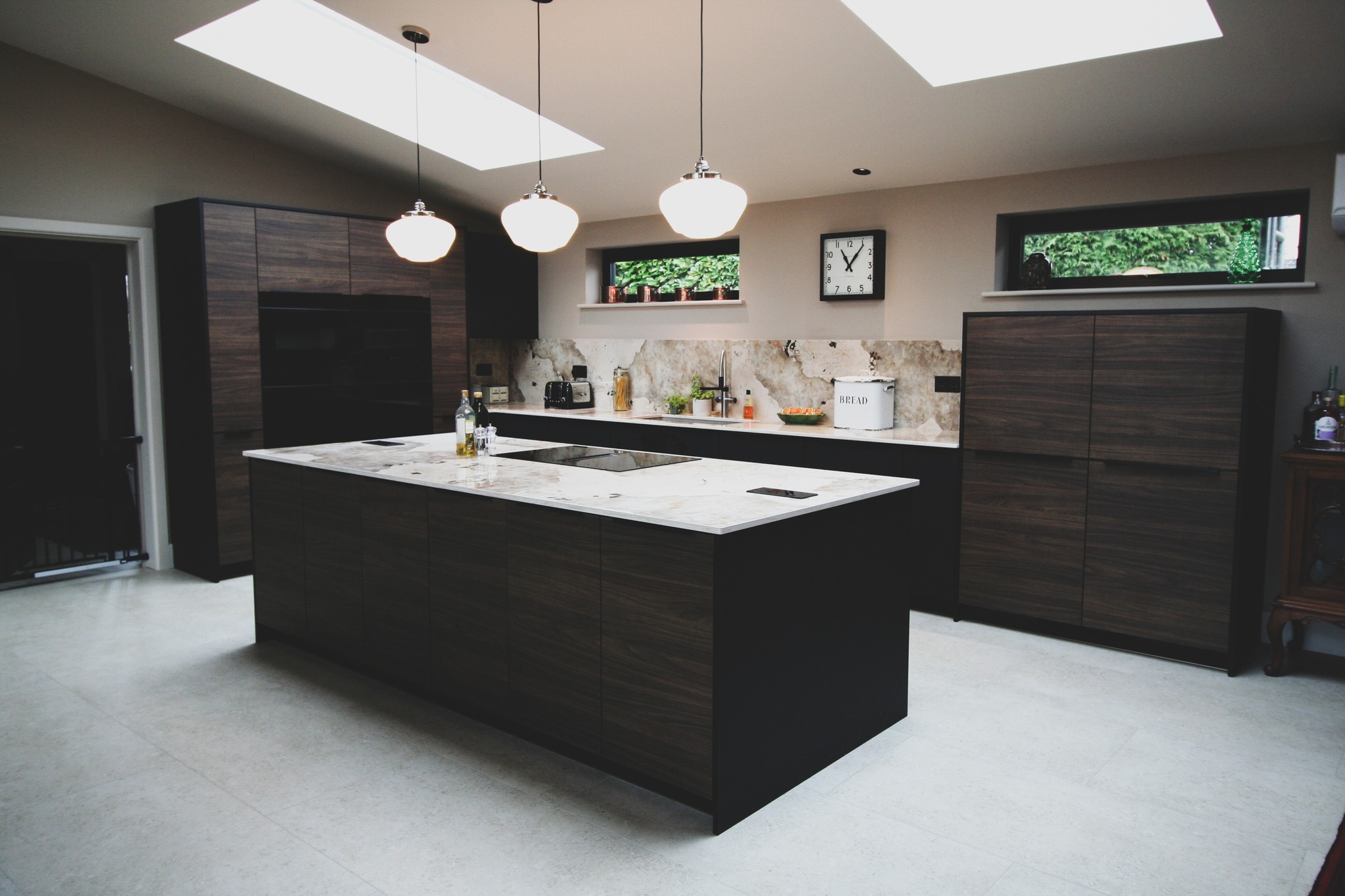 Walnut and black super-matt — a kitchen by Kitchensmiths, with dekton Khalo worktops (photograph 3 of 10)