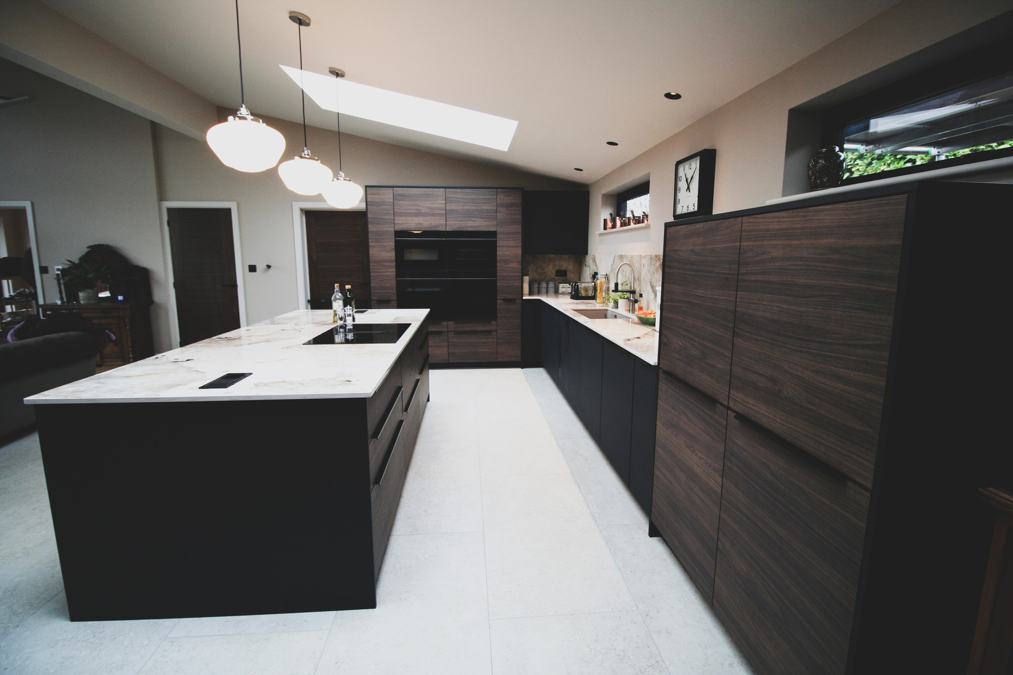 Walnut and black super-matt — a kitchen by Kitchensmiths, with dekton Khalo worktops (photograph 6 of 10)