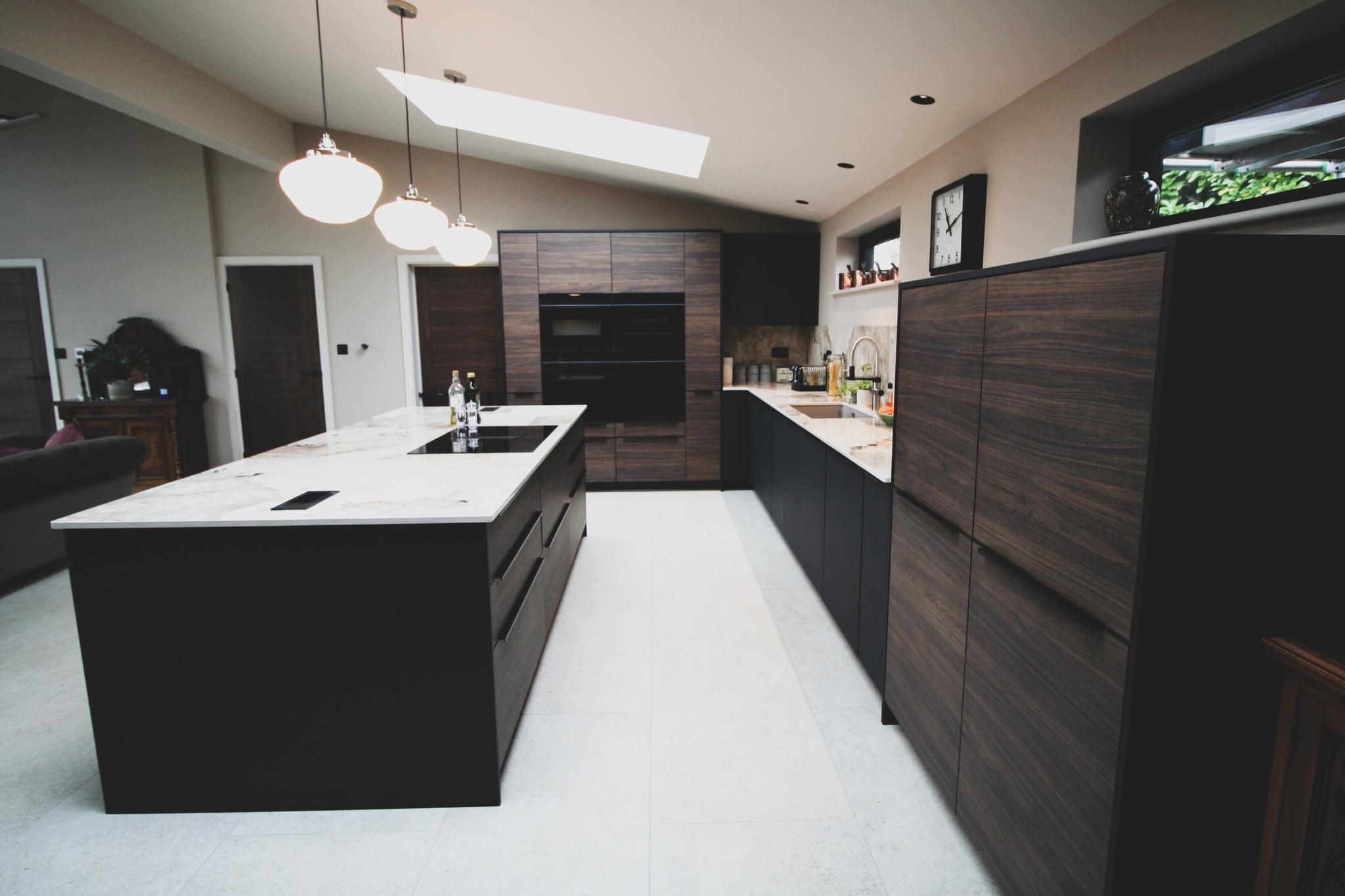 Walnut and black super-matt — a kitchen by Kitchensmiths, with dekton Khalo worktops (photograph 7 of 10)
