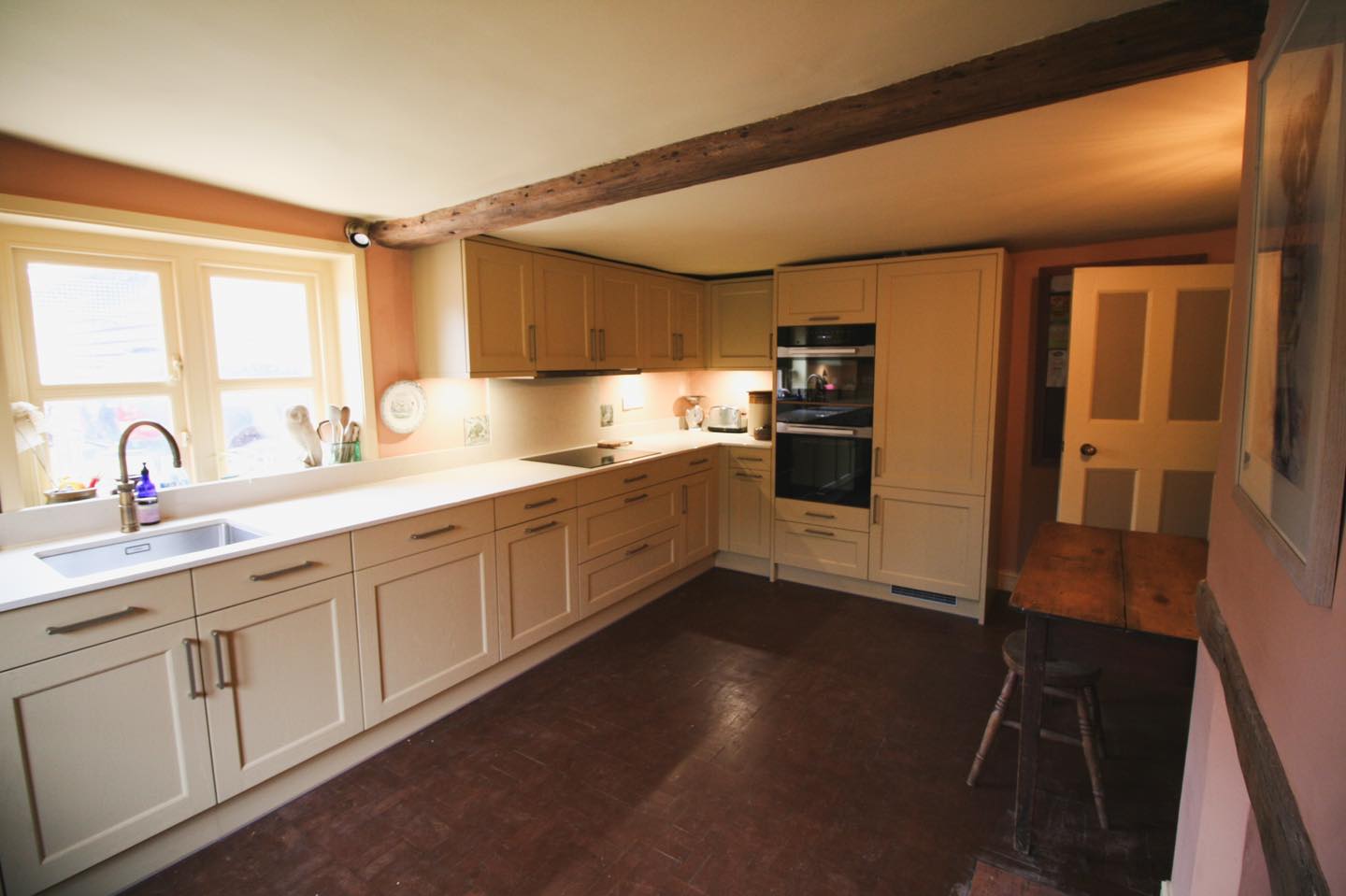 A farmhouse kitchen in the old Cheese Room — a Stoneham kitchen by Kitchensmiths, with dekton worktops (photograph 2 of 3)