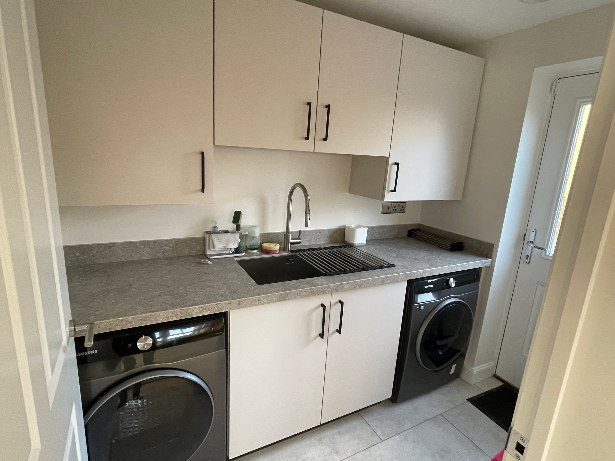 Kitchen and utility, understated — a Sachsenküchen kitchen by Kitchensmiths, with dekton Grigio worktops (photograph 2 of 7)