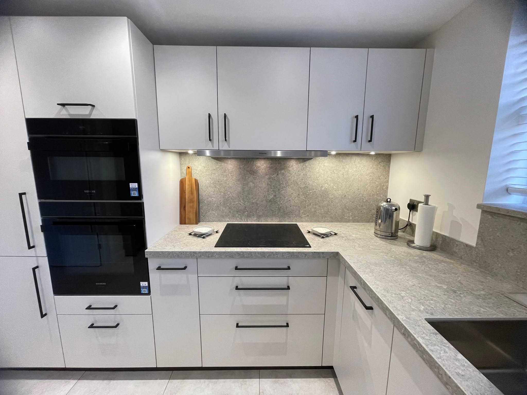 Kitchen and utility, understated — a Sachsenküchen kitchen by Kitchensmiths, with dekton Grigio worktops (photograph 5 of 7)
