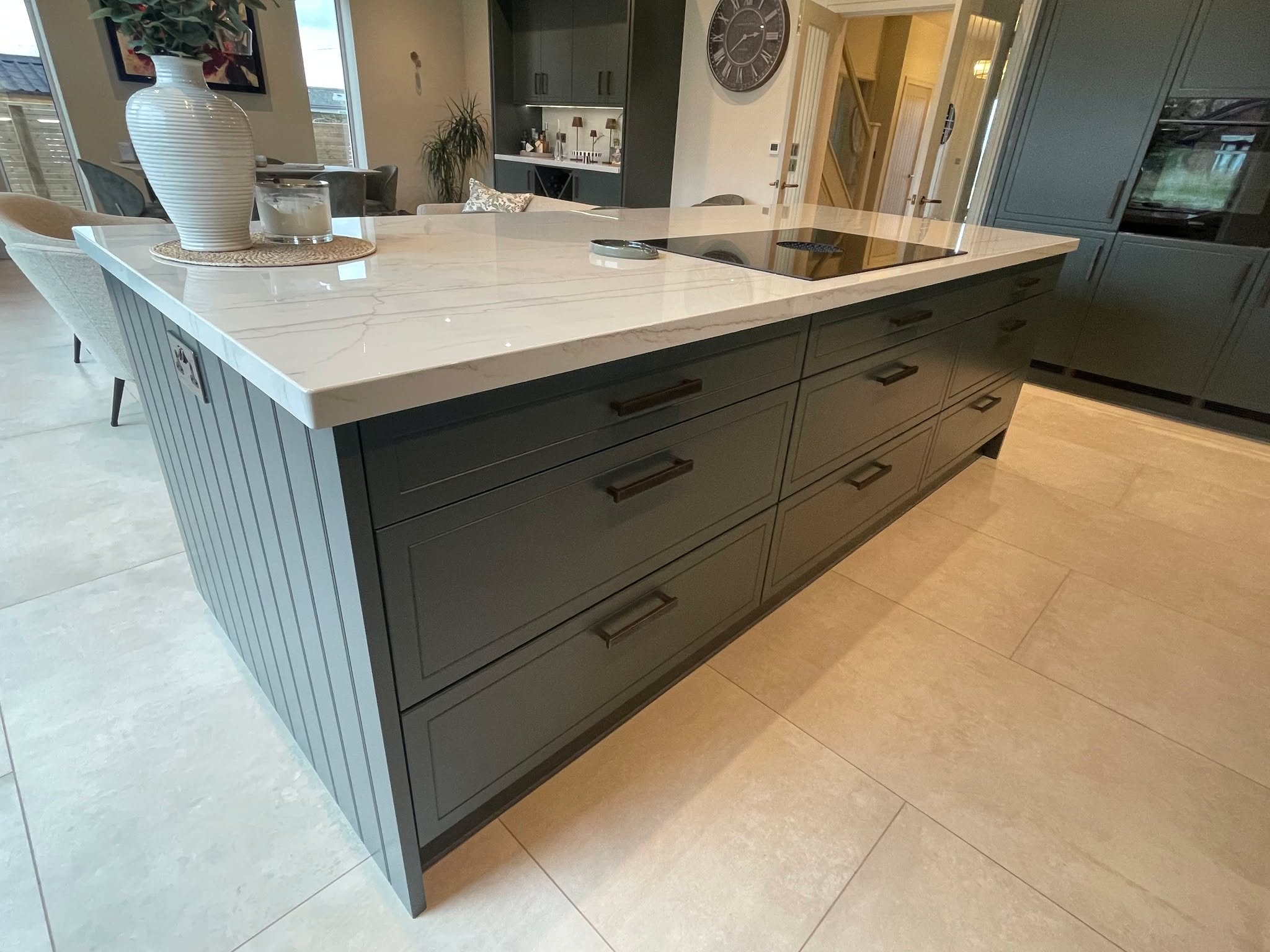 Studio Green, kitchen and living space as one — a Stoneham kitchen by Kitchensmiths, with dekton Limbo worktops (photograph 2 of 6)