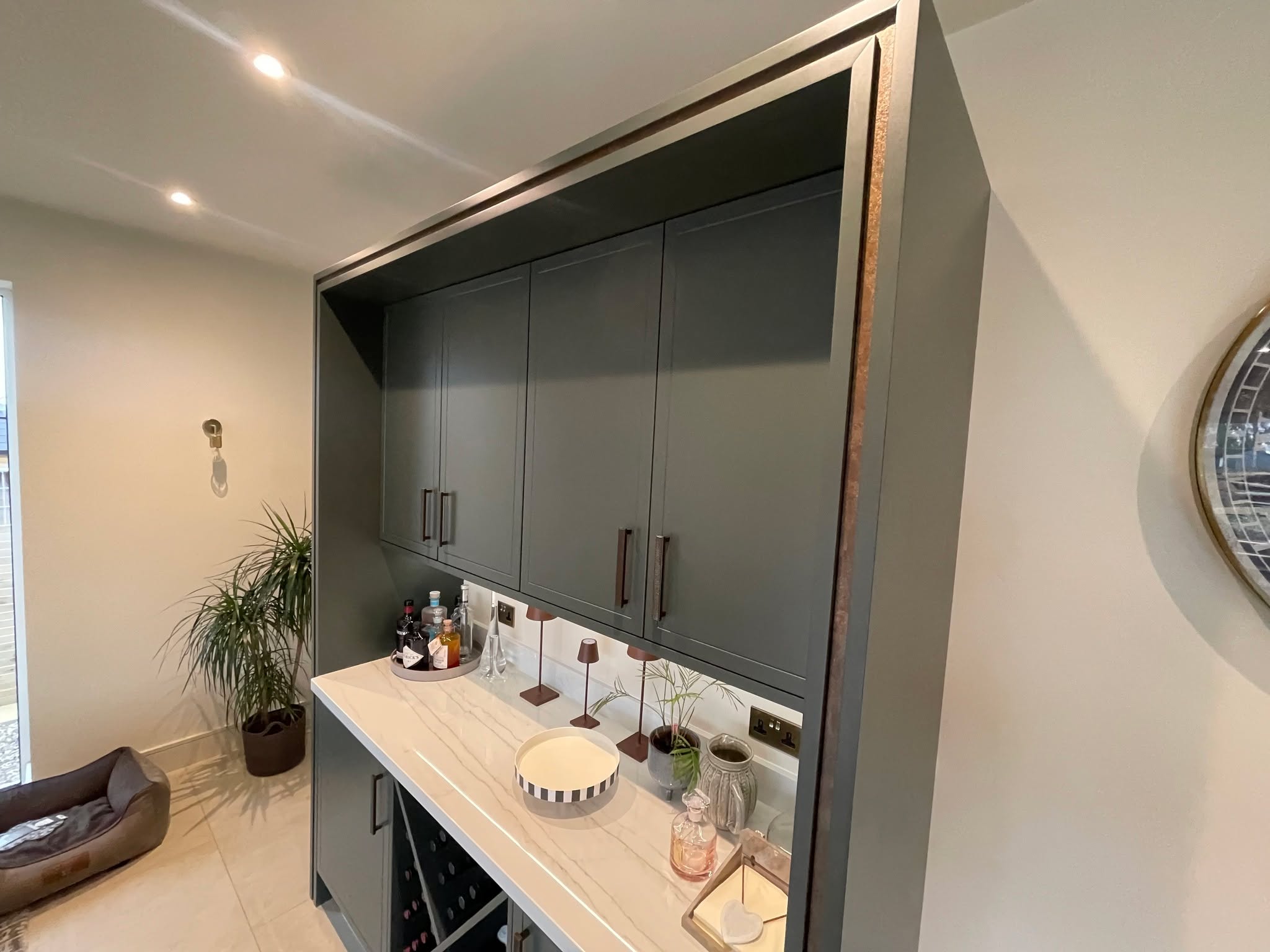 Studio Green, kitchen and living space as one — a Stoneham kitchen by Kitchensmiths, with dekton Limbo worktops (photograph 4 of 6)