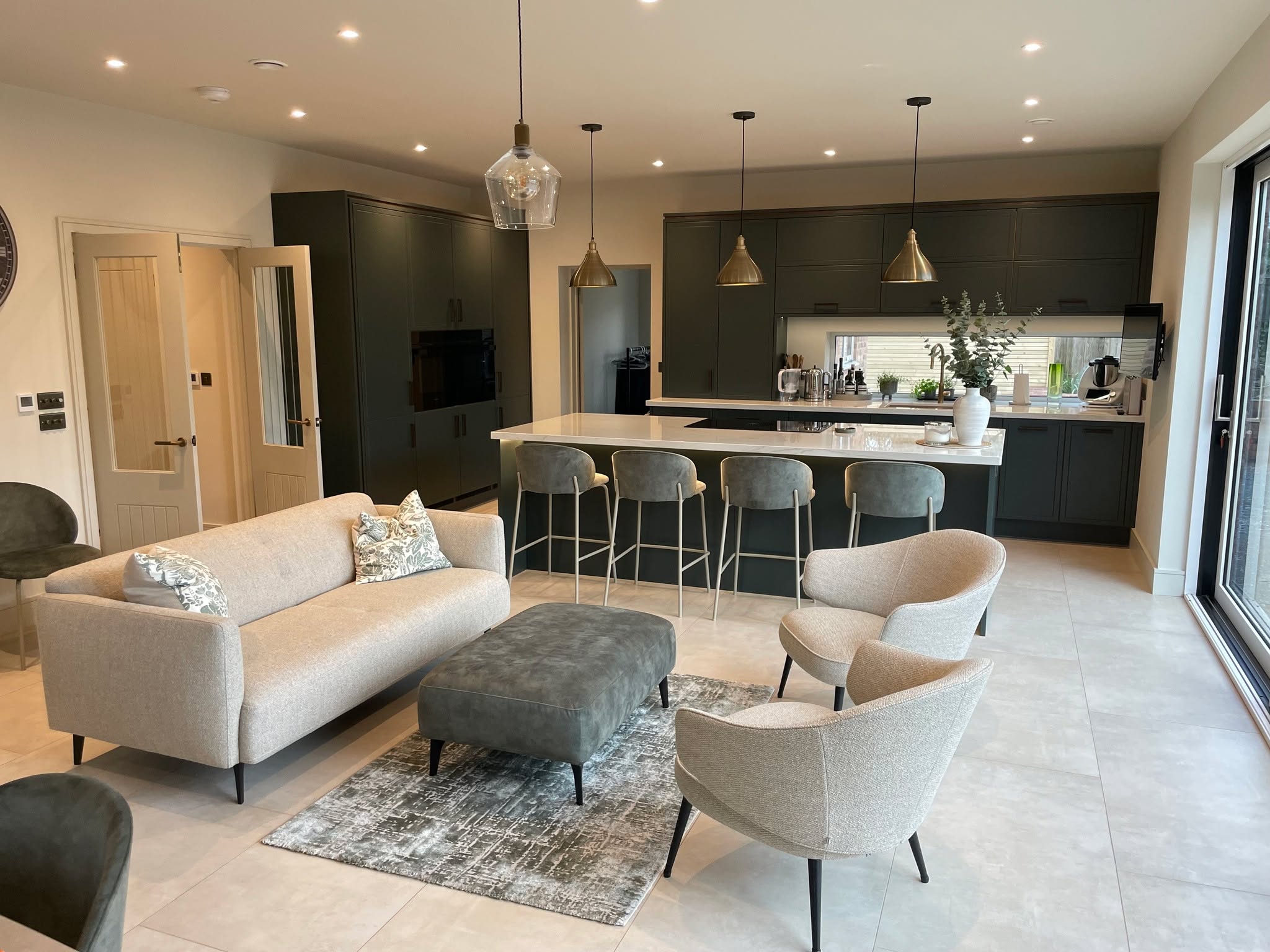 Studio Green, kitchen and living space as one — a Stoneham kitchen by Kitchensmiths, with dekton Limbo worktops (photograph 6 of 6)