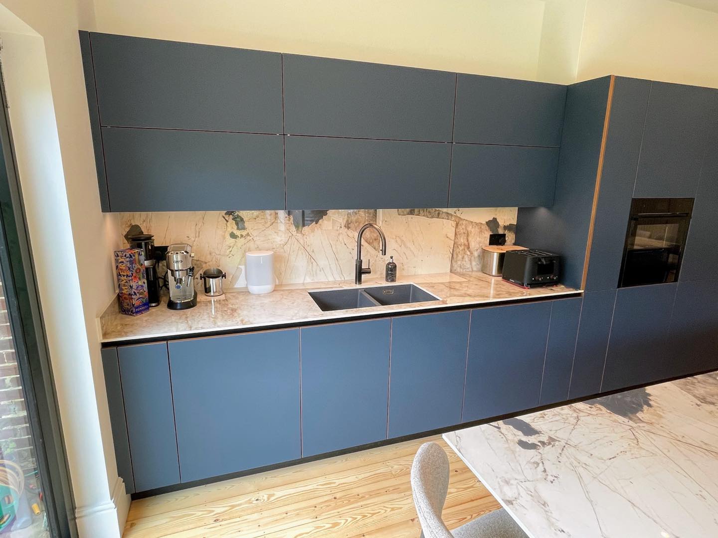 Real walnut, quietly done — a Sachsenküchen kitchen by Kitchensmiths (photograph 2 of 5)