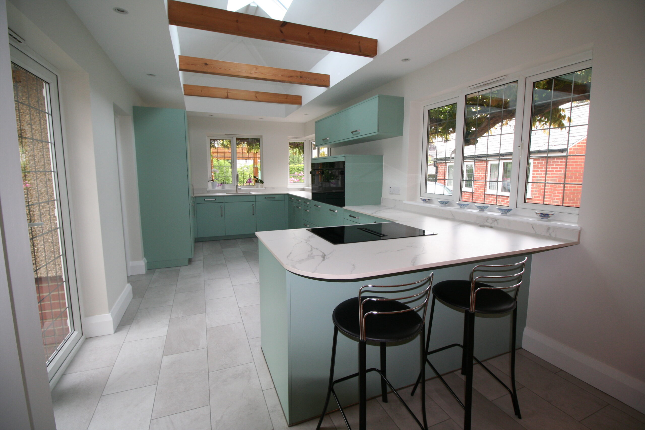 Senta in duck egg, under Dekton Aura — a Sachsenküchen kitchen by Kitchensmiths, with dekton Aura worktops