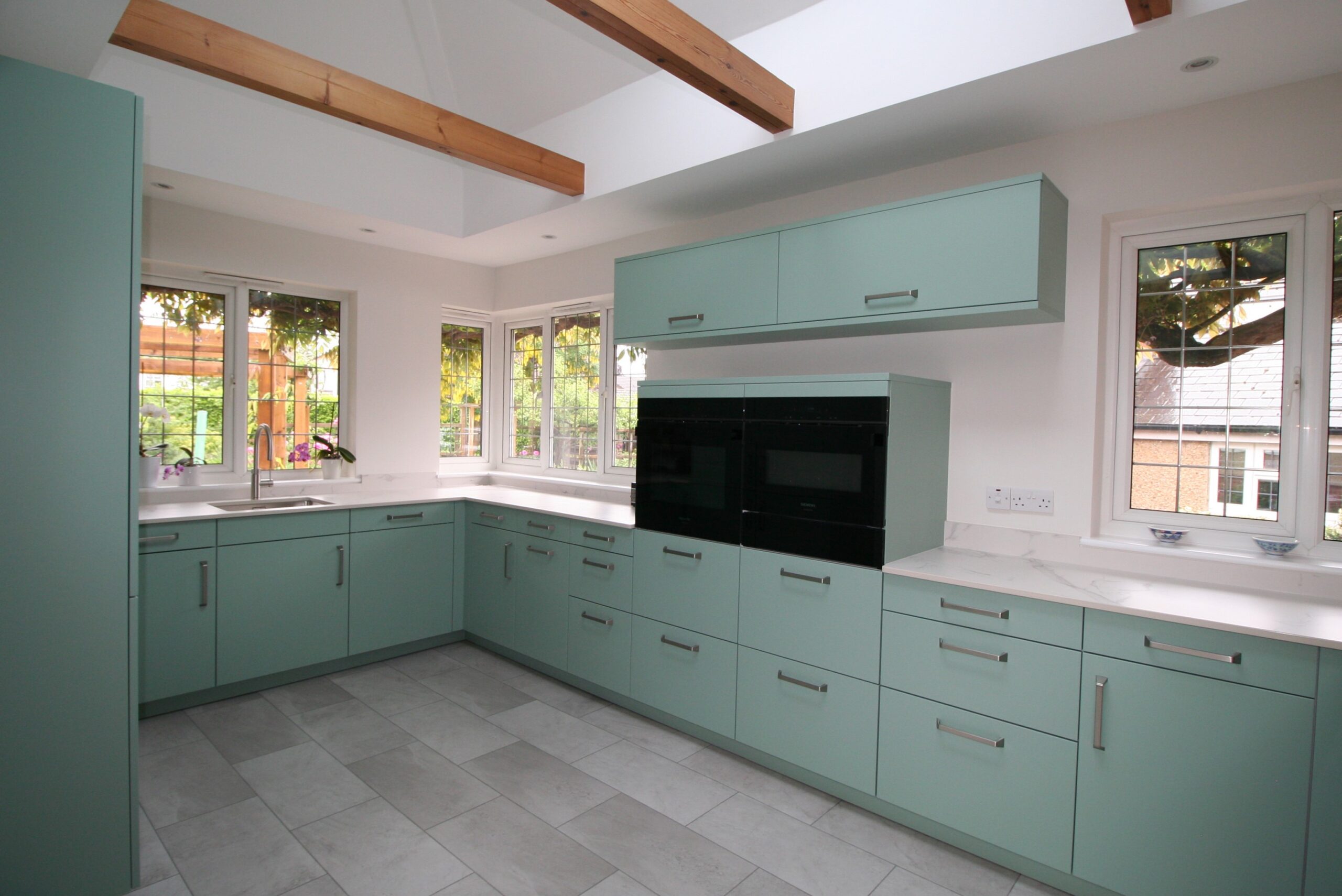 Senta in duck egg, under Dekton Aura — a Sachsenküchen kitchen by Kitchensmiths, with dekton Aura worktops (photograph 4 of 5)