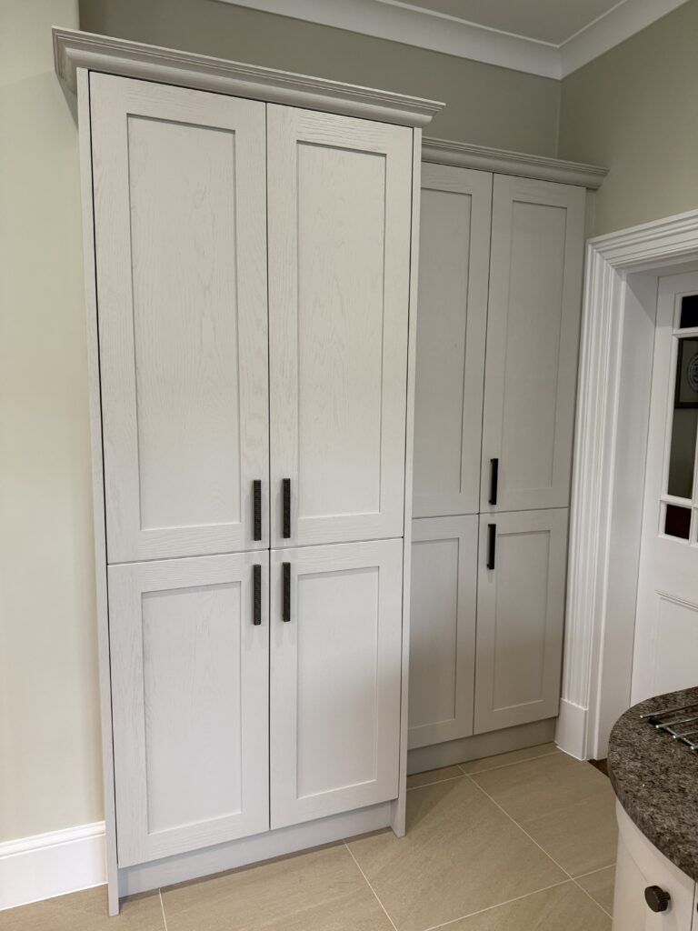Cashmere and Aegean Blue, under Antique Labrador — a Stoneham kitchen by Kitchensmiths (photograph 8 of 9)