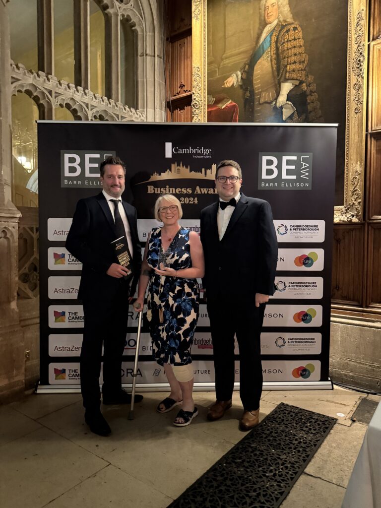 Three of the Kitchensmiths team with a trophy at the Cambridge Business Awards